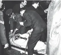  ?? MONTREAL STAR ?? Pierre Laporte’s body is taken from the trunk of 1968 Chevrolet on Oct. 18, 1970.