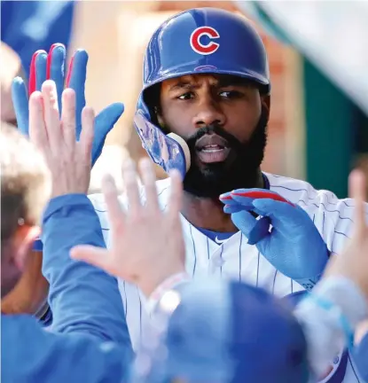  ?? JON DURR/ GETTY IMAGES ?? Jason Heyward suffered a concussion when he banged his head against the outfield wall May 6 in St. Louis.