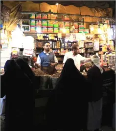  ??  ?? Yemenis shop at the market in Sanaa’s old city. — AFP photo