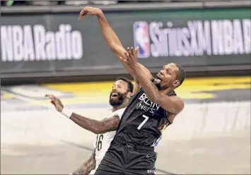  ?? Elsa / Getty Images ?? Kevin Durant of the Nets gets fouled by James Johnson of the Pelicans. Durant scored 17.