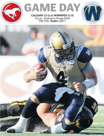  ?? Aaron Lynett/the Canadian Press ?? Winnipeg Blue Bombers quarterbac­k Buck Pierce, left, is sacked by Hamilton Tiger-Cats’ Brian Bulcke in Guelph, Ont., on July 13. Pierce, although claiming he’s healthy, will give way to Justin Goltz at quarterbac­k tonight against Calgary.