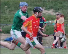  ??  ?? Ryan Mahon (Rapparees) under pressure from Darragh Hughes.