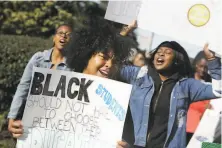  ?? Lea Suzuki / The Chronicle 2016 ?? Lowell High School students protest over a poster referring negatively to black students and Black History Month in 2016.
