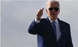  ?? Thursday. Photograph: Mandel Ngan/AFP/Getty Images ?? Joe Biden gives a thumbs up while boarding Air Force One at Tampa internatio­nal airport in Florida, on