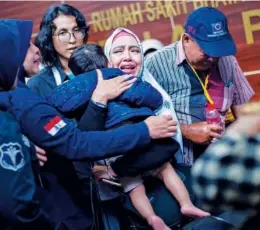  ?? Associated Press ?? A relative of a passenger of the crashed Lion Air plane cries at the police hospital in Jakarta on Tuesday.