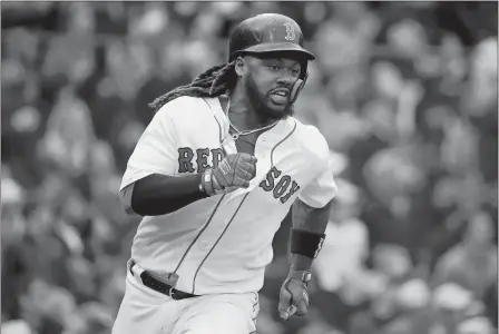  ?? MICHAEL DWYER/AP PHOTO ?? Boston’s Hanley Ramirez hustles on his two-run double Saturday during the fourth inning against Baltimore at Fenway Park.