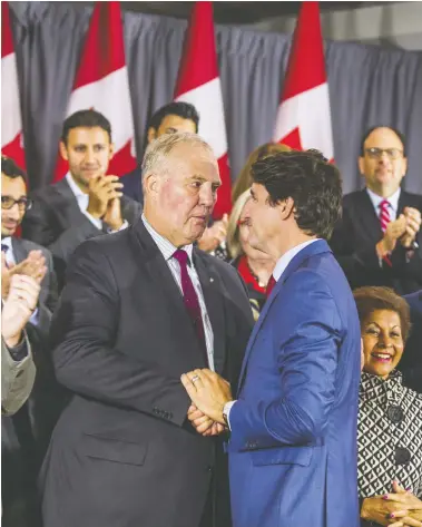  ?? ERNEST DOROSZUK / POSTMEDIA NEWS ?? Liberal Leader Justin Trudeau shakes hands with Bill Blair, the former Toronto police chief and candidate for Scarboroug­h Southwest, during a Liberal election event Friday at Toronto Don Valley Hotel and Suites.