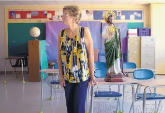  ?? ROBERTO E. ROSALES/JOURNAL ?? Queen of Heaven Principal Mary Catherine Keating glances across one of the now-empty classrooms. After decades of service, the elementary school has closed due to low enrollment.