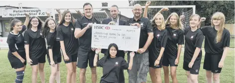  ?? Vince Smith (manager) and John Bell (assistant manager) with Sean Feeley, marketing manager for Mick George Ltd with some of the Peterborou­gh Northern Star U15s girls team who have received £1,000 sponsorshi­p from Mick George. ??