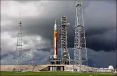  ?? Kevin Dietsch / Getty Images ?? NASA'S Artemis I rocket sits on launch pad 39-B on Friday at Kennedy Space Center in Cape Canaveral, Fla. After the scrub on Monday, liftoff will again be attempted on Saturday.