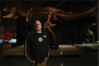  ?? PETER LEE, RECORD STAFF ?? James Jensen, Supervisor of Collection­s and Exhibits, Waterloo Region Museum, stands in the dinosaur exhibit space at the museum.