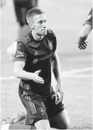  ?? CHRIS SWEDA / CHICAGO TRIBUNE ?? Fire forward Robert Beric is seen reacting after missing a scoring chance in the April 17 opener.