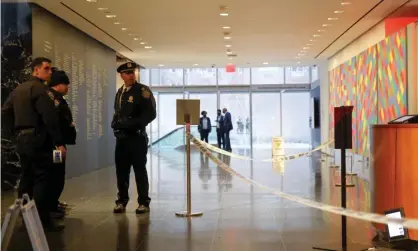  ?? Photograph: Andrew Kelly/REUTER ?? New York City Police Department gather in the lobby of the Museum of Modern Art after an alleged multiple stabbing incident, in New York, on Saturday.