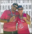  ?? SUBMITTED PHOTO TREVOR COPELAND ?? Trevor and Lynnette Copeland smile after finishing the annual Conquer the Valley obstacle race in Elkwater. After the passing of their friend and team member, Susan Geib, Trevor decided to have special pink shirts made for his team to run in during...