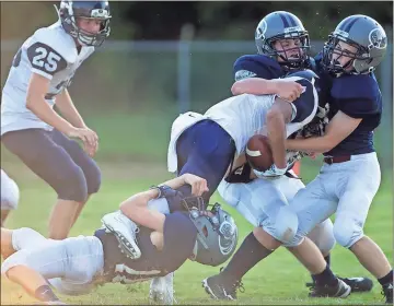  ?? Steven Eckhoff / Rome News-Tribune ?? A group of Unity Christian defenders help to tackle a Shiloh Hills Christian player during Friday’s game at Grizzard Park.