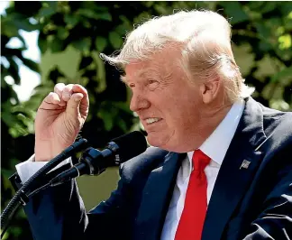  ?? REUTERS ?? Announcing his decision that the US would withdraw from the Paris climate accord, Donald Trump claimed that the pact would achieve only "tiny" temperatur­e reductions.