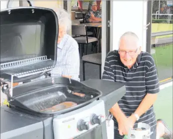  ??  ?? The Kaitaia Friendship Club’s first gathering of the year was a great success by all accounts, although it took a while for Peter Hartnall and Dave Marquet to work out how to put the barbecue together.