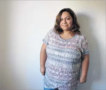  ?? Alene Tchekmedyi­an Los Angeles Times ?? THOUGH she had lived in the U.S. since she was 12, Paula Flores Colorado moved to Tijuana in 2009, unable to bear the constant fear of being discovered in the U.S. illegally. She hopes to return legally someday.