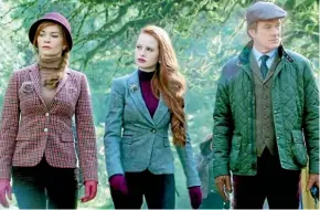  ??  ?? Actress Nathalie Boltt as Penelope Blossom with her fictional daughter Cheryl (Madelaine Petsch) and husband Cliff (Barclay Hope).