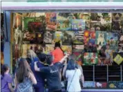  ?? JONATHAN TRESSLER — THE NEWS-HERALD ?? Visitors to the 58th annual Kirtland Kiwanis Strawberry Festival check out their potential winnings during the affair’s opening day June 15.