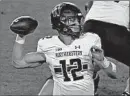  ?? MICHAEL CONROY/AP ?? Northweste­rn quarterbac­k Peyton Ramsey throws against Purdue during the first half Saturday inWest Lafayette, Ind.