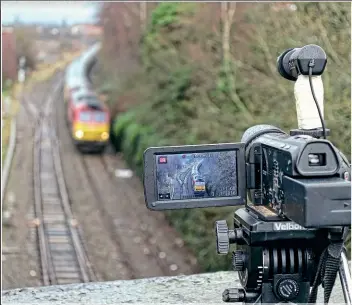  ?? NIGEL CAPELLE ?? Caught in the screen of a video camera, 60020 approaches Bull Street bridge in Brierley Hill, West Midlands, with a leg of Pathfinder Tours’‘The Mini Tug’ railtour, from Round Oak to Oxford on January 2, 2016.