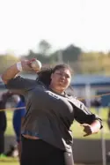  ?? Staff photo by Evan Lewis ?? n Hooks senior Korey Brooks throws the shotput Thursday at the Joe Culpepper Relay in Redwater, Texas. Brooks’ throw was good for first place at 36.5 feet.