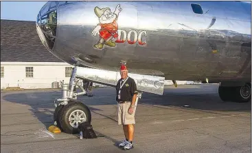  ??  ?? Jacob Greeling of Bella Vista stands next to a Boeing B-29 Superfortr­ess on display at Drake Field in Fayettevil­le in honor of the 75th anniversar­y of the end of World War II.
(Courtesy Photo)