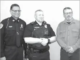  ?? Mona Weatherly ?? Pictured above after the official pinning of the chevrons for Sgt. Chris Anderson are Broken Bow Police Chief Steve Scott, Sgt. Anderson and Mayor Rod Sonnichsen.