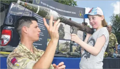  ?? FM4813252 ?? Dannii Luckhurst, 10, is shown a rocket propelled grenade launcher by Sgt Greg Wilkinson