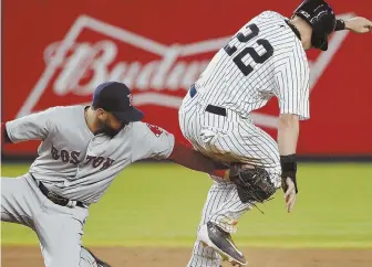  ?? AP PHOTO ?? TOO LATE: Red Sox second baseman Deven Marrero applies a late tag on New York’s Jacoby Ellsbury, who stole second during the first inning of last night’s game.