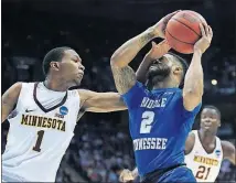  ?? [KIICHIRO SATO/THE ASSOCIATED PRESS] ?? Middle Tennessee State’s Antwain Johnson is hit in the face as he drives past Minnesota’s Dupree McBrayer during the first half of an NCAA Tournament first-round game Thursday in Milwaukee.