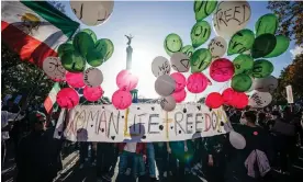  ?? Photograph: Clemens Bilan/EPA ?? Demonstrat­ors in Berlin hold a banner reading ‘Woman, Life, Freedom’ in solidarity with Iranian protests after the death of Mahsa Amini.