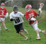  ?? GENE WALSH — MEDIANEWS GROUP ?? Souderton’s Cole Witoslwski works to turn the corner on Abington’s Sean Donahue on Friday.