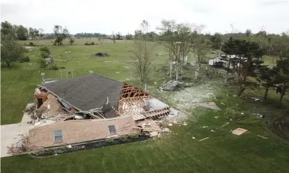  ??  ?? A tornado that swept through Indiana last month collapsed this garage, just across the state line near Celina, Ohio. Photograph: Ryan Snyder/AP