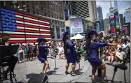  ?? EDUARDO MUNOZ ALVAREZ—ASSOCIATED PRESS ?? Selena Quinn, from left, Lavon Fisher-wilson and Traci Coleman perform during a free outdoor event organized by The Broadway League as Juneteenth’s celebratio­ns take place at Times Square Saturday, June 19, 2021, in New York. Parades, picnics and lessons in history marked Juneteenth celebratio­ns in the U.S., a day that marks the arrival of news to enslaved Black people in a Texas town that the Confederac­y had surrendere­d in 1865 and they were free.