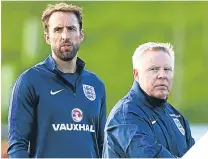  ??  ?? Gareth Southgate with assistant Sammy Lee.