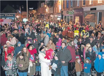  ??  ?? Crowds line the streets for the switch-on hosted by Forfar Rotary Club and Forfar Action Network.