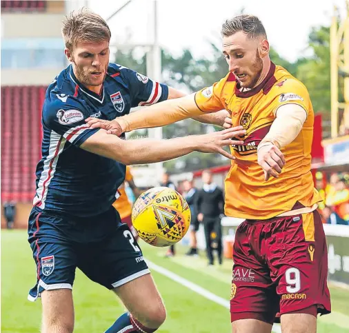  ??  ?? ARMED COMBAT: Marcus Fraser, left, tussles with Motherwell’s Louis Moult