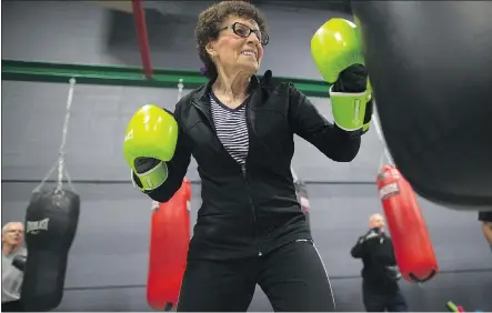  ?? TODD KOROL/THE CANADIAN PRESS ?? Shirley Jager, who has Parkinson’s disease, works out at the Grizzly Cage Boxing Club in Calgary. Boxing is one of a number of therapies patients are embracing.