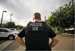  ?? ASSOCIATED PRESS FILE PHOTO ?? A U.S. Immigratio­n and Customs Enforcemen­t officer looks on during an operation earlier this month in Escondido, Calif. Advocacy groups and unions are pressuring Marriott, MGM and other hotel companies not to house migrants who have been detained by ICE. But the U.S. government says it sometimes needs bed space, and if hotels don’t help it might have to split up families.