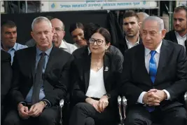  ?? ARIEL SCHALIT — THE ASSOCIATED PRESS FILE ?? Blue and White party leader Benny Gantz, left, Esther Hayut, the Chief Justice of the Supreme Court of Israel, center, and Israeli Prime Minister Benjamin Netanyahu attend a memorial service for former President Shimon Peres in Jerusalem.