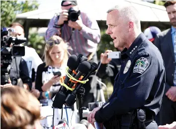  ?? — Reuters photo ?? Manley speaks during a news conference near the scene where a woman was injured in a package bomb explosion in Austin, Texas.