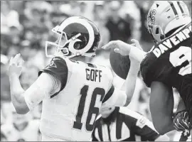  ?? Wally Skalij Los Angeles Times ?? RAMS QUARTERBAC­K Jared Goff loses the ball as he tries to pass. The Saints returned the ball for an apparent touchdown but the play had been whistled dead.