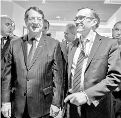  ?? — Reuters photo ?? Greek Cypriot President Nicos Anastasiad­es (left) and Special Adviser to the United Nations Secretary-General on Cyprus Espen Barth Eide, arrive for a new round of Cyprus Peace Talks, at the European headquarte­rs of the United Nations, in Geneva,...
