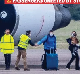  ??  ?? 2: PASSENGERS GREETED BY STAFF — SOME EVEN SHAKE HANDS ON TARMAC