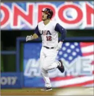  ?? ALAN DIAZ — THE ASSOCIATED PRESS ?? United States’ Nolan Arenado rounds second base after hitting a three-run home run against Canada in the second inning in a first-round game of the World Baseball Classic, Sunday in Miami. Adam Jones and Christian Yelich also scored on the home run....