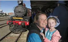  ??  ?? Carlee Bischof and daughter Allira White are excited to see a steam train pull into Toowoomba Railway Station.