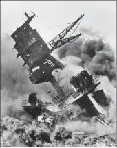  ?? AP ?? In this December 7, 1941 photo, smoke rises from the battleship USS Arizona as it sinks during the attack on Pearl Harbour.