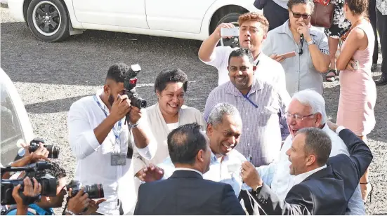  ?? Photo: Ronald Kumar ?? Fiji Times Limited lawyer Wylie Clarke and lawyer Nicholas Barnes celebrate with Publisher Hank Arts and Editor-in-Chief Fred Wesley High and some staff members outside court on May 22, 2018.